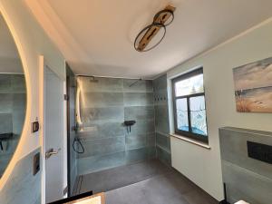 a bathroom with a shower and a window at Lake House Ternsche in Selm +91 photos
