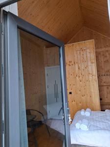 a room with a bed and wooden walls at AnArt resort in Vanadzor +8 photos