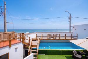 a view of the ocean from the balcony of a house at El Templo Surf House in Punta Hermosa