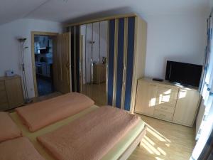 Łóżko lub łóżka w pokoju w obiekcie Ferienwohnung GIA
