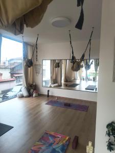 a room with a room with yoga mats on the wall at Sandanski Peak Guest Rooms in Sandanski