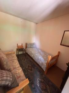 a room with a bed and a couch in it at Ritrovo Neggia in Vira