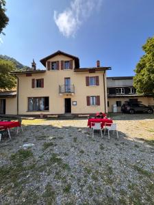 a large house with a table in front of it at Ritrovo Neggia in Vira