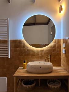 a bathroom with a sink and a mirror at Stella Apartment in Nardò