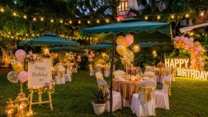 a party with tables and balloons and lights and lights at Amritha Heritage in Trivandrum