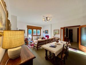 a living room with a table and chairs and a living room at 1Dest - Garda Vintage in Arco