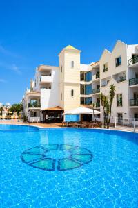 a large swimming pool in front of a building at Grand Muthu Forte do Vale in Albufeira