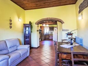 a living room with a couch and a table at Holiday Home Luce by Interhome in Dicomano