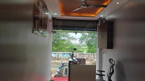 a room with a window with a view of a room at Hotel Trilok in Ujjain