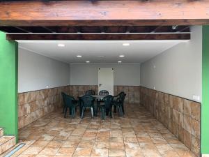 a dining room with black chairs and a table at R2R - Casa Los Abuelos - C19A02 in Gormazo