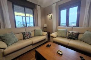 a living room with two couches and a coffee table at R2R - Casa Los Abuelos - C19A02 in Gormazo