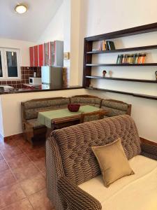 a living room with a couch and a table at Lavanda in Budva