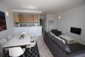 a living room with a couch and a table at Teresita 2 in Empuriabrava