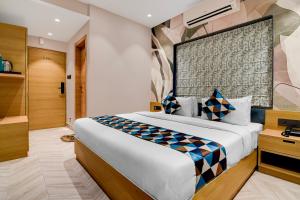 a bedroom with a large bed in a room at Morya Villa - A Boutique Hotel in kolkata
