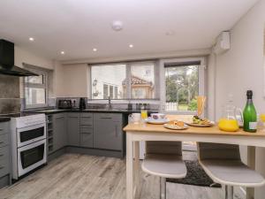 a kitchen with a table with food on it at Little Herriotts in Bristol +10 photos