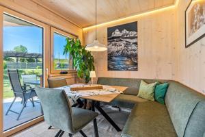 a living room with a couch and a table at Tiny House in Pischelsdorf am Engelbach