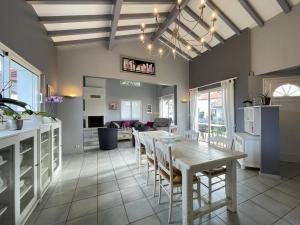 a kitchen and dining room with a table and chairs at Uhalden borda in Saint-Jean-de-Luz