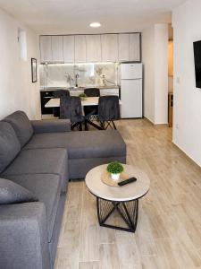 a living room with a couch and a table at White Arches in Ulcinj