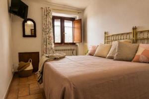 a bedroom with a large bed and a window at La Dolce Casa Centre Free Parking Family in Celano
