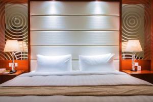 Voodi või voodid majutusasutuse Grandview Hotel Macau toas