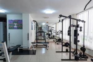 a gym with several treadmills and tread machines at Hotiday Tenerife Norte in Puerto de la Cruz