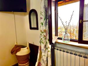 a window in a room with a curtain and a window at La Dolce Casa Centre Free Parking Family in Celano +12 photos