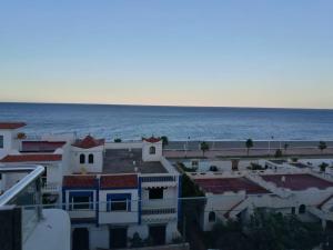 a view of the ocean from a building at Huge oceanfront apartment in Tétouan +5 photos