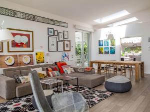 a living room with a couch and a table at Villa Mulberry Garden by Interhome in San Marcello