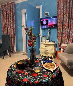 a living room with a table with food on it at Sea & Sun Grigoleti in Grigoleti