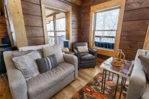 a living room with a couch and a chair at Shawnee Ridge Lodge in Banner Elk +55 photos