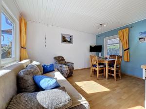 a living room with a couch and a table at Apartment Gabi-2 by Interhome in Wiek auf Rügen