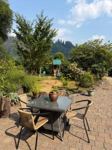 a table and chairs on a patio at Ty Derw B & B in Dinas Mawddwy