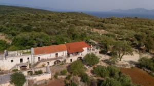 an aerial view of a building on a hill at Authentic Dalmatian Stone House-Kameni dvori in Selca kod Bogomolja