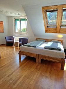 a bedroom with a bed and a living room at Casa Maria West in Solothurn