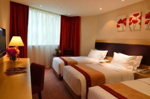 Voodi või voodid majutusasutuse Grandview Hotel Macau toas