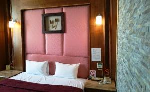 Postelja oz. postelje v sobi nastanitve 富晴汽車旅館Fu Ching Motel
