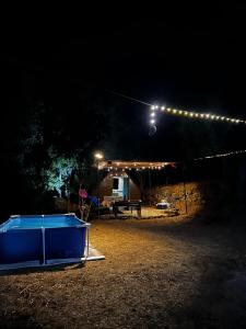 a lit up tent at night with lights on it at Kroom cabins in Bâne +7 photos