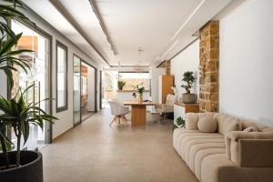 a living room with a couch and a table at Axopetra Boutique Hotel in Agiassos