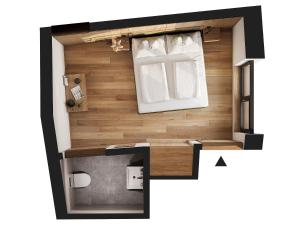 a floor plan of a tiny house with a window at Weingut Santer Apartments in Mühlbach +51 photos