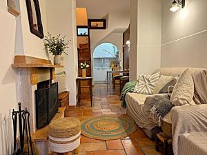 a living room with a couch and a fireplace at La Dolce Casa Centre Free Parking Family in Celano