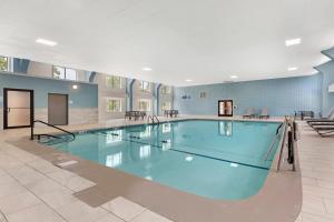 a large swimming pool in a building at Holiday Inn Express Hyannis - Cape Cod by IHG in Hyannis