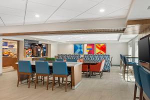 a dining room with a table and chairs at Holiday Inn Express Hyannis - Cape Cod by IHG in Hyannis