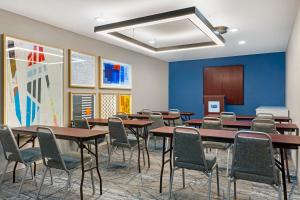 a conference room with tables and chairs and a podium at Holiday Inn Express Hyannis - Cape Cod by IHG in Hyannis +46 photos