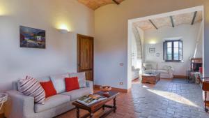 a living room with a couch and a table at ALBORATA 10, Emma Villas in San Giovanni dʼAsso
