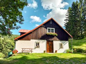 a barn with a picnic table in front of it at Pension Skalicky in Pec pod Sněžkou