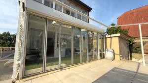 a glass extension to a building at Basel Haven in Münchenstein