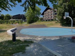 an empty basketball court with a basketball hoop at Hotel Alte Innbrücke - Neuhaus am Inn in Neuhaus am Inn