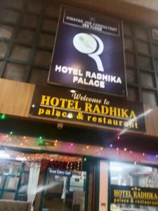 a sign for a hotel raadalhaajaajaajaajaajaaja palace at Hotel Radhika Palace in Raipur