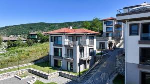 an apartment building with a view of a mountain at Best Western Plus Sapanca in Sapanca