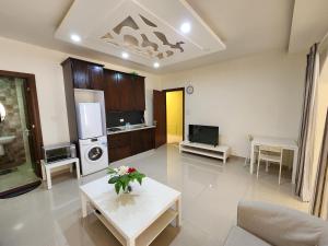 a living room with a couch and a table at Al-Amaari Gardens Compound 3092 in Irbid